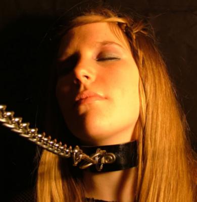 bdsm woman with collar and chain 